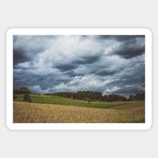 Stormy cloudscape over fields and pasture Sticker